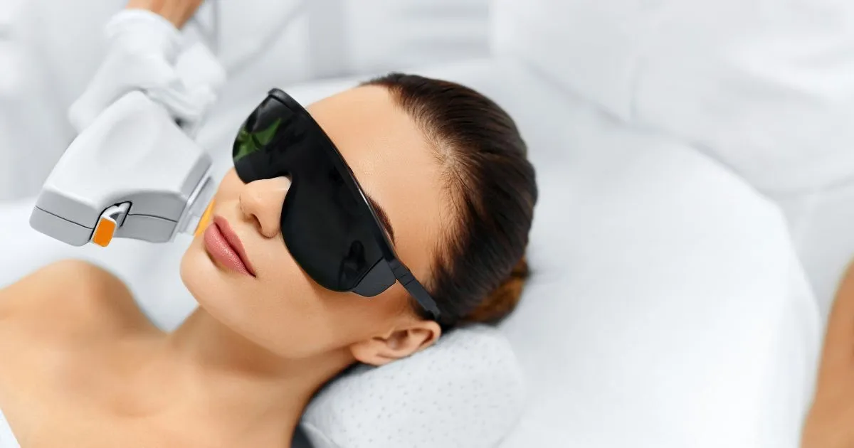 Woman receiving an IPL Photofacial at a skincare clinic in Venice, FL